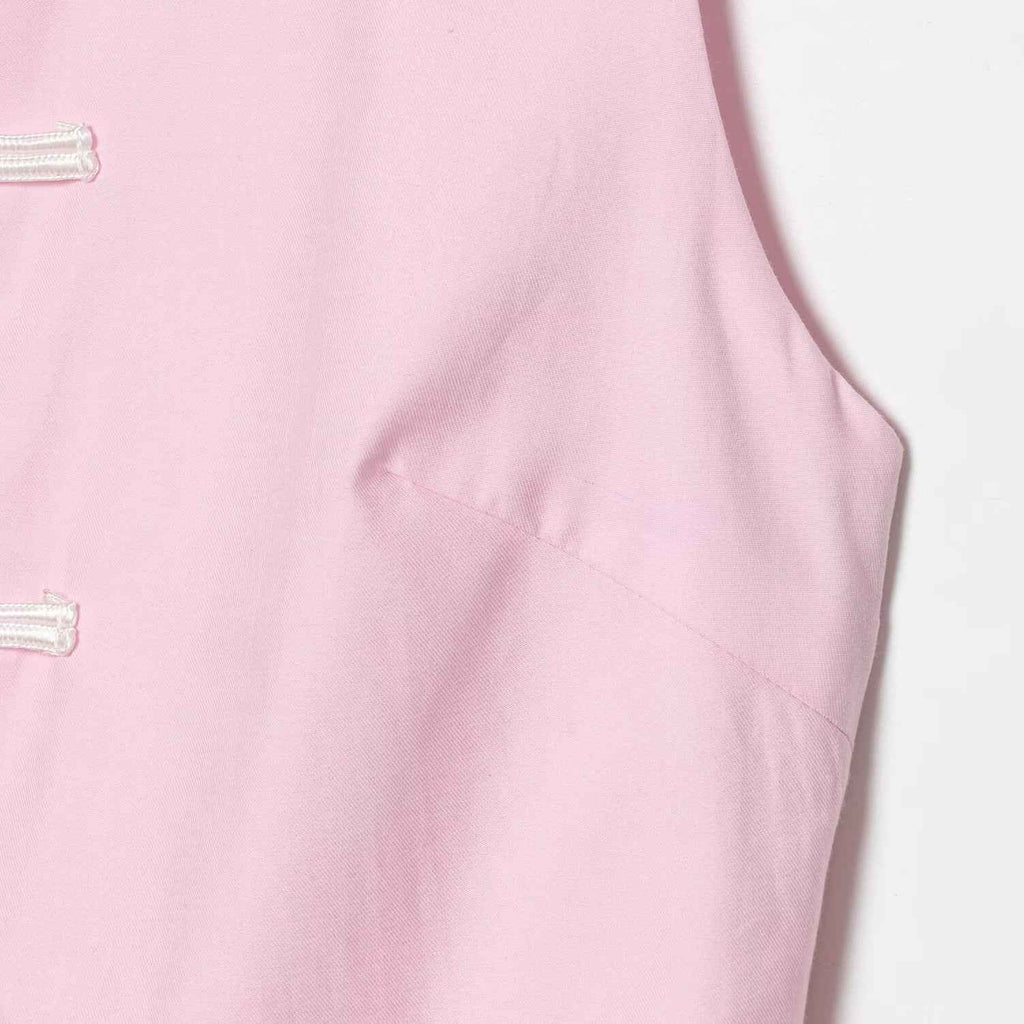 Sleeveless knot buckle embellished short skirt style hem top